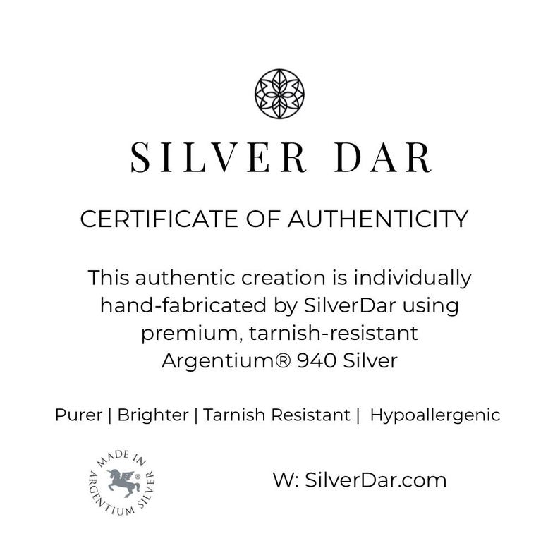 May include: A white certificate of authenticity from Silver Dar featuring a circular logo at the top. The text reads: SILVER DAR CERTIFICATE OF AUTHENTICITY. This authentic creation is individually hand-fabricated by SilverDar using premium, tarnish-resistant Argentium 940 Silver. Purer | Brighter | Tarnish Resistant | Hypoallergenic. Includes a Made in Argentium Silver logo and the website W: SilverDar.com.