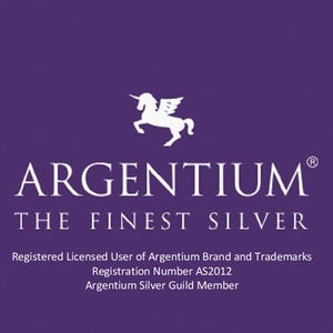 May include: A purple graphic featuring a white winged unicorn icon above the text ARGENTIUM THE FINEST SILVER. Below this, the text reads Registered Licensed User of Argentium Brand and Trademarks, Registration Number AS2012, Argentium Silver Guild Member.