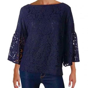 May include: A navy blue lace top with a boat neck and bell sleeves. The top is made of a delicate floral lace fabric. The sleeves are flared, adding a touch of elegance to the design. The top is a solid color and appears to be a blouse.