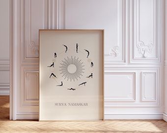May include: A black and white illustration of the 12 poses of Surya Namaskar, or Sun Salutations, in a circular pattern. The poses are outlined in black and set against a white background. The text "SURYA NAMASKAR" is printed in black at the bottom of the illustration.