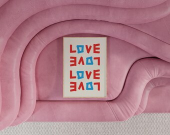 May include: A framed print with the word "LOVE" repeated four times in a vertical stack. The word is written in red and blue letters with a white background.