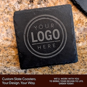 May include: Black slate coaster with a circular design that says "YOUR LOGO HERE" in a white font.