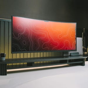 May include: A black curved monitor with a red and orange abstract design on the screen sits on a black monitor stand with a shelf. The stand is on a white surface.