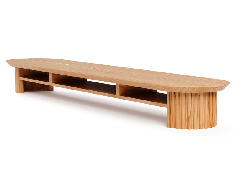 May include: A light brown wooden bench with a curved top and a slatted base. The bench has two open storage compartments and measures approximately 183 cm long.