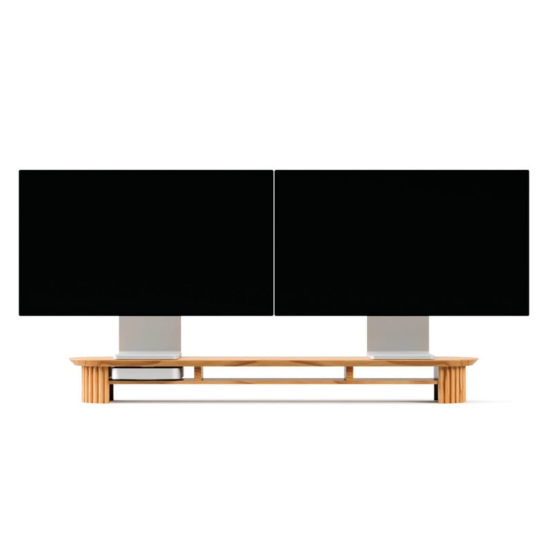 May include: A wooden monitor stand with two black computer screens. The stand has a light brown finish and a minimalist design, with a shelf for accessories. The screens are mounted on silver stands.