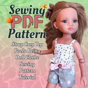 May include: A doll wearing a white floral crop top and gray shorts with a pink bow. The image includes text that reads "Sewing PDF Pattern" and lists "Strap Crop Top, Paola Reina, Doll Clothes, Sewing Pattern, Tutorial."