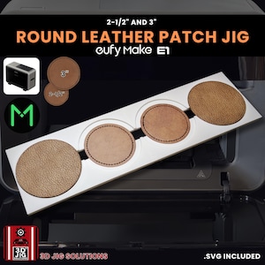 May include: A white jig with four circular cutouts, each holding a round leather patch. The patches are various shades of brown. Text on the jig reads "ROUND LEATHER PATCH JIG" and "2-1/2" AND 3". The product is for a cufy Make E1.