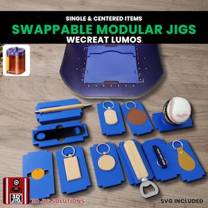 May include: A selection of blue modular jigs with diverse cutouts and accessories, such as keyrings, a bottle opener, and a baseball. The image includes the text "SWAPPABLE MODULAR JIGS" and "WECREAT LUMOS".