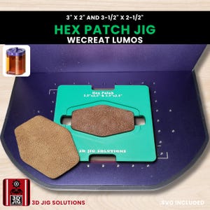 May include: A Hex Patch Jig with the text "WECREAT LUMOS" and measurements of 7.6 cm x 5.1 cm and 8.9 cm x 6.4 cm. The jig is green with a brown leather patch and a separate tan leather patch. The image also includes the text "3D JIG SOLUTIONS".