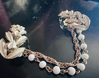 1960's Gold Toned Enamel Sweater Clip with Pearl Beaded Chain
