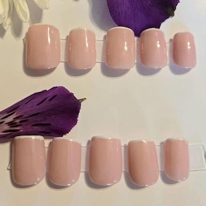 May include: A rustic wooden sign with the text "Welcome to our home" in white lettering. The sign has a distressed finish and a simple, inviting design, suitable for a front porch or entryway.