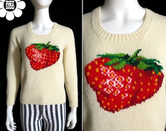 Suéter icônico vintage dos anos 70 com emblema de morango, estilo pulôver grosso.