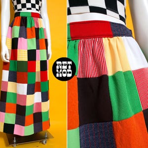 May include: A floor-length skirt featuring a patchwork design of multicolored fabric squares in red, orange, yellow, green, black, white, and pink. The skirt has a high waistband and is paired with a black and white checkered crop top.