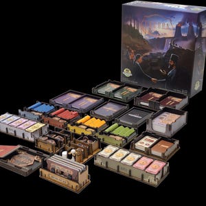 May include: A board game set titled Tycoon featuring a large illustrated box and numerous wooden organizers filled with various game components, including stacks of cards, small tokens, and colored markers arranged on a black surface.