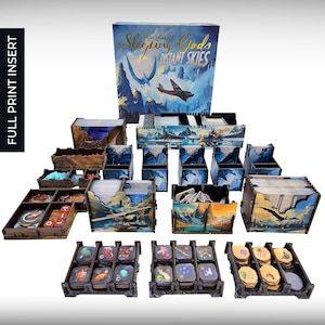 May include: A wooden game organiser insert for the board game "Sleeping Gods: Distant Skies". The insert features multiple compartments for storing cards, tokens, and other game components. The insert is designed to fit inside the game box and keep all of the game's components organised.