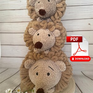 May include: Three crocheted hedgehog plush toys stacked on top of each other. The hedgehogs are brown and beige with black eyes and brown noses. The image includes the text "PDF" and "DOWNLOAD".