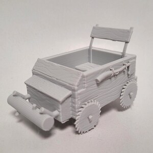May include: A gray wooden wagon with a seat and a wooden back. The wagon has two wheels and a wooden log attached to the back.
