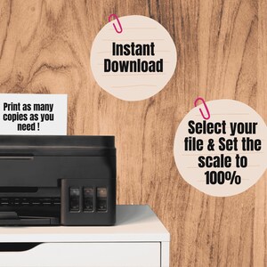 May include: A black printer sits on a white surface, with text that reads "Print as many copies as you need!" and instructions for downloading and scaling a file to 100%. The background is a wood grain.