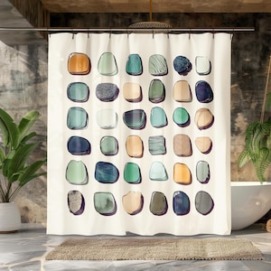 May include: A white shower curtain with a pattern of colorful abstract shapes resembling stones. The shapes are arranged in a grid pattern and are in shades of green, blue, brown, and orange.