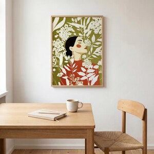 Vertical painting of a dark-haired woman immersed in dense botanical forms. White and cream blossoms, buds, and long leaves create a layered garden around her red-orange clothing and softly lit face.