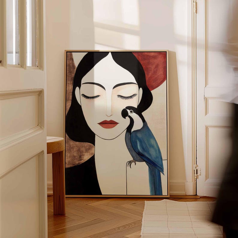 Minimalist feminine portrait showing a woman with porcelain skin, flowing black hair, and peaceful closed eyes. A richly colored blue parrot rests gently on her shoulder, its beak angled toward her face as if in quiet companionship. The soft neutral backdrop in beige and warm brown hues contrasts with the vivid blue bird, emphasizing stillness, elegance, and silent connection.