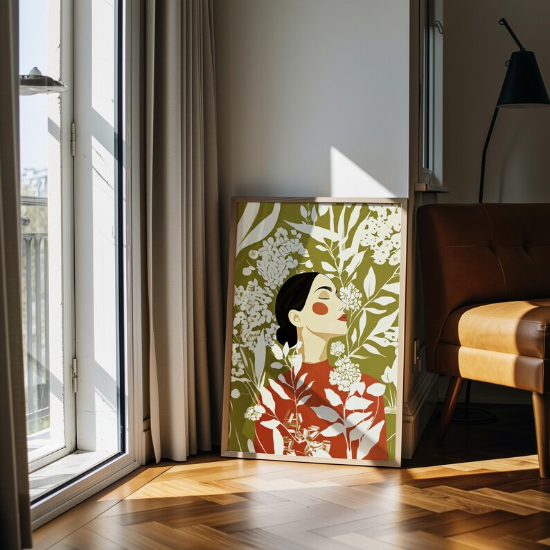 Feminine portrait surrounded by an abundant garden of cream flowers and elongated leaves. The woman’s closed eyes, lifted chin, black hair, orange cheek, and red lips create a composed, introspective expression.