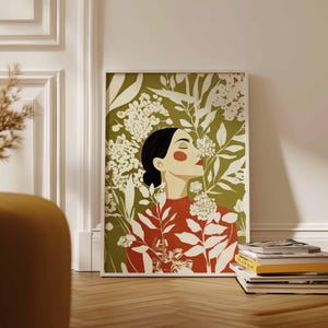 Botanical female portrait in a modern folk-inspired style, featuring a peaceful side profile surrounded by cream blossoms. A vivid terracotta red garment adds warmth against the muted olive green setting.