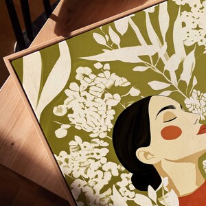 Serene woman portrait with a long elegant neck, closed eyes, black hair, orange blush, and red lips. Layered cream flowers and leafy stems weave across the figure and fill the olive green background.