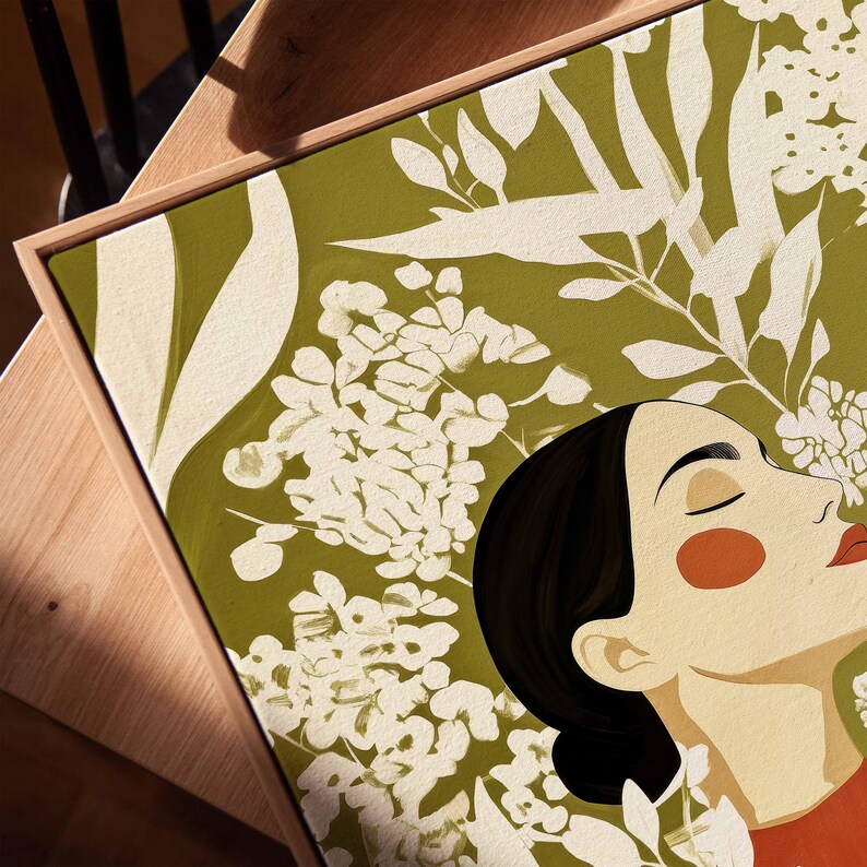 Serene woman portrait with a long elegant neck, closed eyes, black hair, orange blush, and red lips. Layered cream flowers and leafy stems weave across the figure and fill the olive green background.