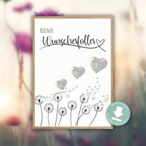 May include: A framed print featuring the text "Kleiner Wunschfüller" and three heart-shaped images of 20 Euro notes. Dandelion illustrations are at the bottom, with small hearts and dandelion seeds floating upwards.