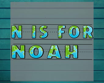 May include: A heat transfer design with the text "N IS FOR NOAH" in a playful font. The letters are blue and green, featuring a world map design. The words "DTF HEAT TRANSFER" and "READY TO PRESS" are also included.