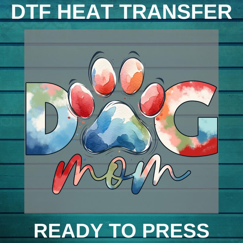 May include: A watercolor design of a paw print with the letters "DOG" on either side and the word "mom" underneath. The design is in shades of blue, red, green, and orange. The text "READY TO PRESS" is at the bottom of the image.