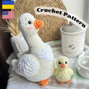 May include: Crochet pattern for a white goose and a yellow chick. The goose has orange feet and a beak. The chick has a yellow body with orange feet and a beak.