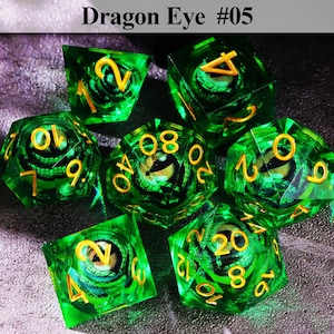 May include: Set of seven green polyhedral dice with gold numbering. Each die features a dragon eye design within. The text "Dragon Eye #05" is at the top. These dice are suitable for tabletop role-playing games.