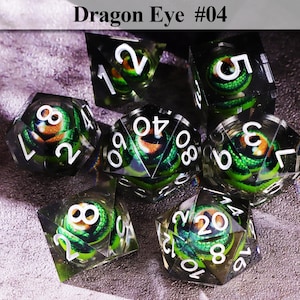 May include: Set of seven polyhedral dice with a dragon eye design. Each die is clear with a green and orange dragon eye core and white numbering. The text "Dragon Eye #04" is at the top.