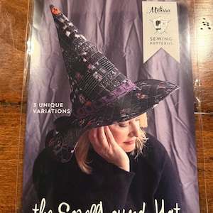 May include: A sewing pattern package titled The Spellbound Hat, A Quilted Witch Hat Sewing Pattern by Melissa Mortenson. The cover features a quilted black witch hat with a purple band, 3 unique variations, and a logo for Melissa Mortenson Sewing Patterns.