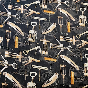 May include: A dark fabric featuring a repeating pattern of various corkscrew designs in silver, gold, and brown. The background is a mottled black with circular text elements. The corkscrews are of different styles.