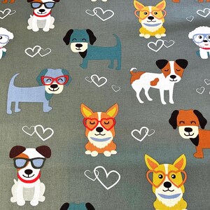 May include: Gray fabric featuring a repeating pattern of cartoon dogs in various colors, each wearing glasses. White heart shapes are scattered throughout the design. The dogs have different colors and patterns.