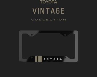 Marco de matrícula de metal con rayas doradas de Toyota vintage
