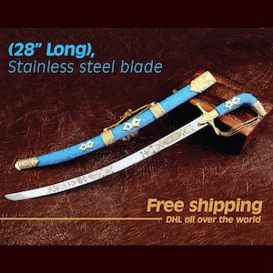 May include: A decorative sword with a stainless steel blade, approximately 28 inches long. The hilt and scabbard are adorned with gold and blue accents. The blade features ornate engravings.