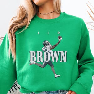 Brown Football Graphic T-Shirt, Philadelphia Fan Tee, Philly Game Day Shirt, Unisex Philly Sports Tee, Casual Sports Wear, Fan Gift