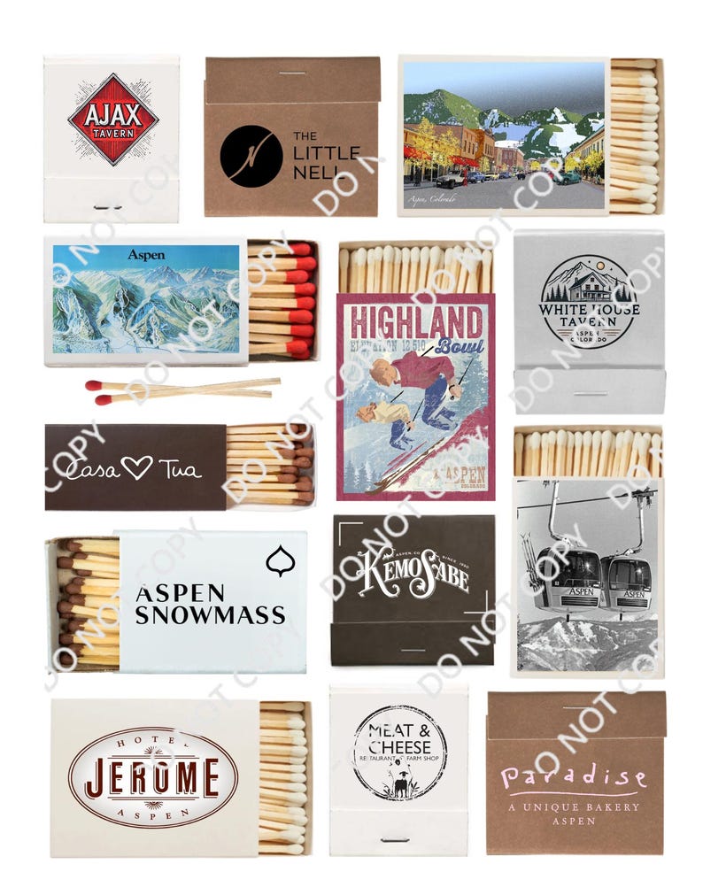 May include: A collection of matchboxes featuring various Aspen, Colorado businesses and landmarks. The matchboxes are arranged in a grid pattern and feature a variety of designs, including a ski resort, a tavern, a bakery, and a hotel. The matchboxes are all made of cardboard and have a white background with black lettering.