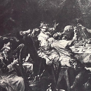 May include: A black and white print depicting a banquet scene with numerous figures gathered around a long table laden with food. A musician plays a stringed instrument. The artwork has a classical style.