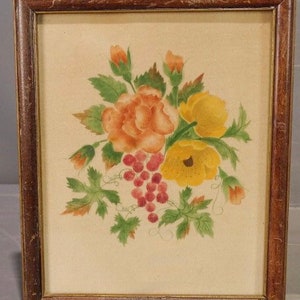 May include: A framed watercolour painting of a bouquet of flowers. The flowers are yellow, orange, and red. The painting is set against a cream-coloured background.