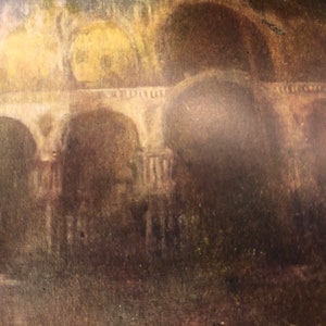 May include: An antique painting depicting a stone bridge with multiple arches. The artwork features a muted color palette of browns, greens, and yellows, creating a vintage aesthetic. The bridge is the focal point, set against a blurred background.