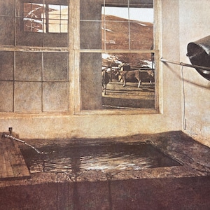 May include: A rustic interior with a window overlooking a field with cows. A stone trough with water is in the foreground, and a metal bucket hangs on the wall.