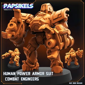 May include: A monochromatic orange miniature figure of a human power armor suit with bulky plating, mechanical joints, and large arm-mounted cannons. The text PAPSIKELS, HUMAN POWER ARMOR SUIT COMBAT ENGINEERS, and MAY 2026 RELEASE are visible.