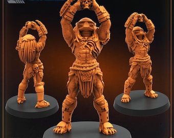 May include: Three detailed, tan-colored Predator figurines, each holding a skull aloft. The figures stand on black circular bases. The text "PAPSIKELS" is at the top, and "RITUAL SKULL HUNTER" is at the bottom. "JUNE 2024 RELEASE" is also visible.
