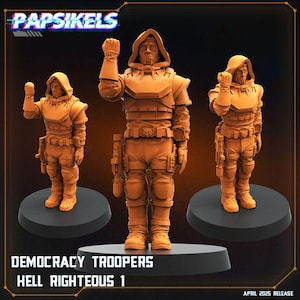 May include: Three orange-brown Democracy Troopers figurines, each posed on a black base. The figures wear hooded armor with tactical gear, including belts and holsters. The text "Papsikels" and "Democracy Troopers Hell Righteous 1" are visible.