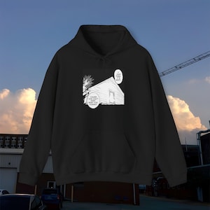 May include: Black hoodie featuring a white graphic print of a manga style illustration of a house with text that reads "Cause you can't see what you forgot".